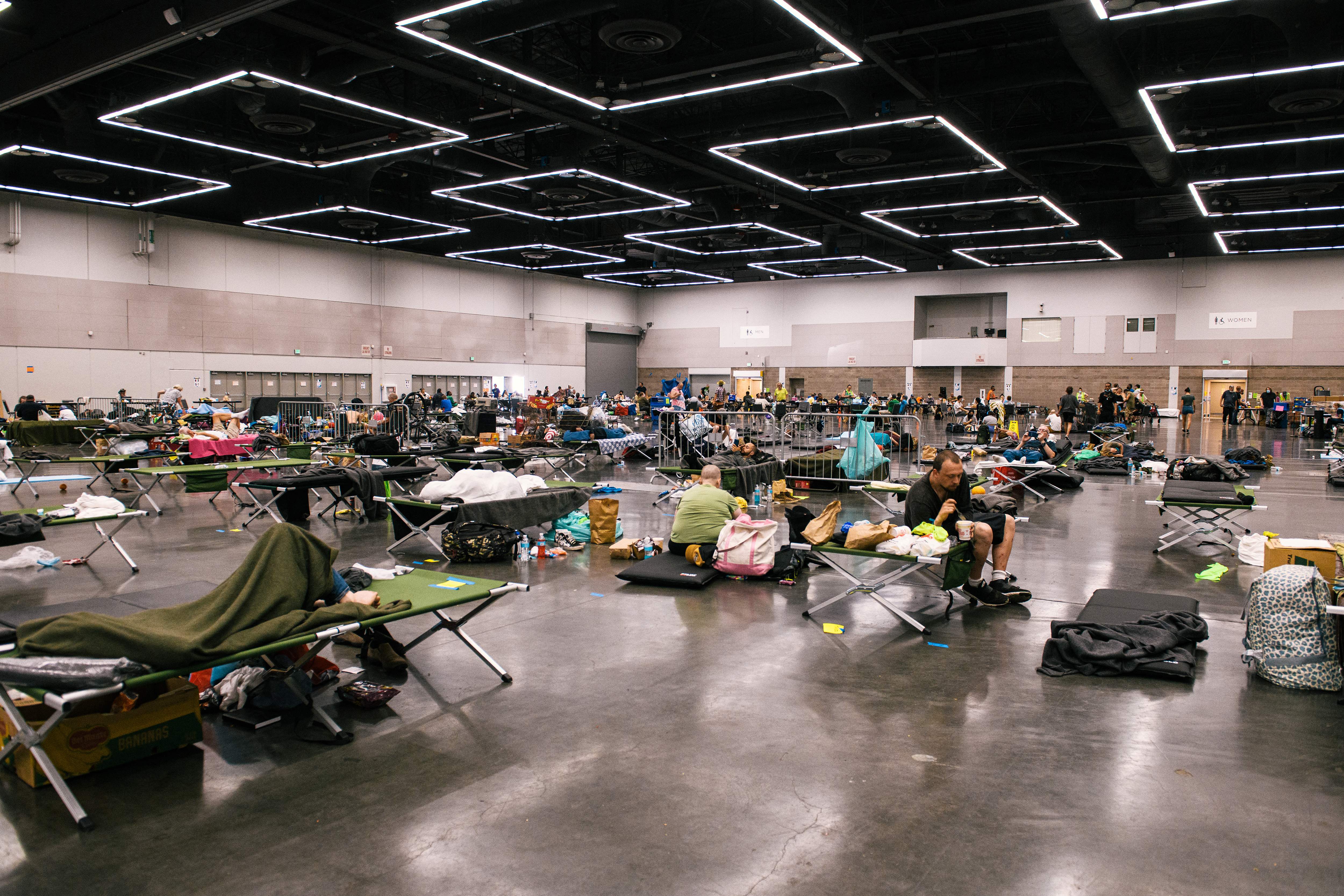 People resting inside a real California emergency cooling center during extreme heat