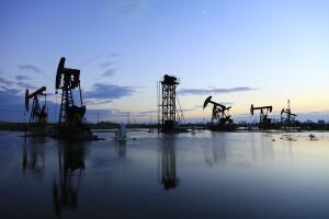 Oil fields in the evening, oil field derrick in the evening,  sunset and sunset