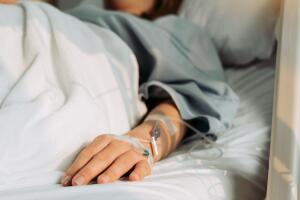 Asian woman lying sick in hospital.