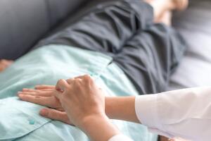 Patient with doctor checking on stomach diseases or gastropathy include gastritis, gastroparesis, diarrhea on senior old female person in hospital.