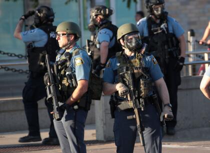 ST. PAUL, MINNESOTA - MAY 28: Police gather near a protest May 28, 2020 in St. Paul, Minnesota. Today marks the third day of ongoing protests after the police killing of George Floyd. Four Minneapolis police officers have been fired after a video taken by a bystander was posted on social media showing Floyd's neck being pinned to the ground by an officer as he repeatedly said, "I can’t breathe". Floyd was later pronounced dead while in police custody after being transported to Hennepin County Medical Center. (Photo by Scott Olson/Getty Images)