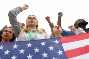 Activists chanting nationalist slogans holding US flag, democratic voting right