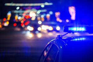 night police car lights in city - close-up with selective focus and bokeh