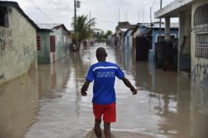 Man in water after Hurricane Matthew