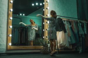 Elegant woman in dressing room before show