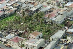 Aerial view of a devasted dwelling area on the Eas
