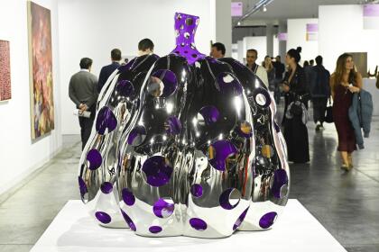 A large-scale pumpkin sculpture by Yayoi Kusama is seen on display Art Basel on Wednesday, Dec. 4, 2024, at Miami Beach Convention Center in Miami Beach. (Photo by Scott Roth/Invision/AP)