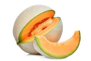 whole and slice of japanese melons, orange melon or cantaloupe melon with seeds isolated on white background
