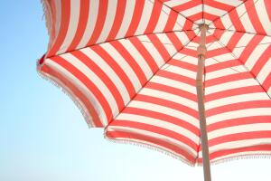 Close-up of red and white striped beach umbrella