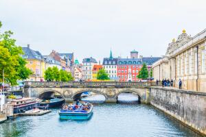 View of a channel next to the Christiansborg Slot Palace in Copenhagen, Denmark.