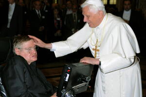 FILE PHOTO: Pope Benedict XVI greets British professor Hawking during a meeting of science academics at the Vatican