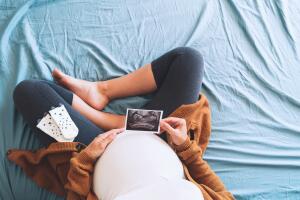 Pregnant,Woman,Holding,Ultrasound,Image.,Concept,Of,Pregnancy,,Health,Care,