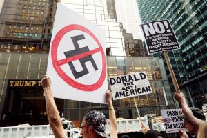 Protesters wave anti-Trump signs during protests in front of Trump Tower in New York City