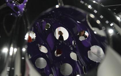 A stainless steel sculpture titled "Pumpkin," by artist Yayoi Kusama, is displayed during Art Basel Miami Beach Wednesday, Dec. 4, 2024, in Miami Beach, Fla. (AP Photo/Lynne Sladky)