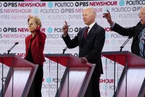 Candidates simultaneously seek the opportunity to speak during the sixth 2020 U.S. Democratic presidential candidates campaign debate at Loyola Marymount University in Los Angeles, California, U.S.