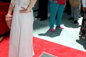 Rita Moreno poses for photos after receiving her s