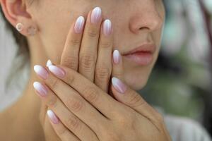 Beautiful woman's nails with beautiful french manicure ombre