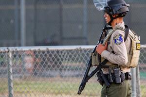 A police officer stands watch at the scene of a mass shooting during the Gilroy Garlic Festival in Gilroy, California