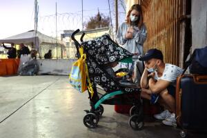 Ukrainian And Russian Migrants Wait To Cross Into U.S. From Mexico