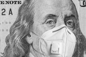 Face of american president in medical mask on dollar bill during economic crisis and pandemic of coronavirus. Realistic and quality montage with currency concept