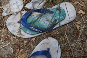 Abandoned flip flops are seen by a migrant crossing on the Rio Grande near Mission
