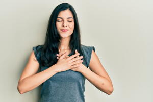 Young,Hispanic,Woman,Wearing,Casual,Clothes,Smiling,With,Hands,On