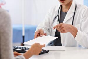Adult woman having a visit at female doctor's office
