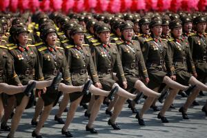 North Korean soldiers march and shout slogans during a military parade marking the 105th birth anniversary of country's founding father in Pyongyang