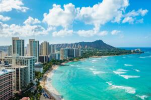 Waikiki Beach and Diamond Head Crater including the hotels and buildings in Waikiki, Honolulu, Oahu island, Hawaii. Waikiki Beach in the center of Honolulu has the largest number of visitors in Hawaii
