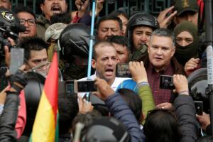Luis Fernando Camacho, President of Civic Committee of Santa Cruz sings the national anthem next to the old presidential palace in La Paz