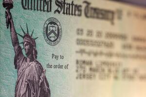 Macro image of IRS TAX RETURN CHECK mailed by post office.