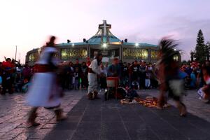 Dancers carry out a ritual at the Basilica of Guadalupe during the annual pilgrimage in honor of the Virgin of Guadalupe, patron saint of Mexican Catholics, in Mexico City