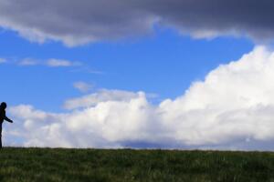 Person Running Through Dark Field