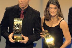 Ronaldo of Brazil and Mia Hamm of the USA with their trophies after winning the 2002 FIFA World Player Awards