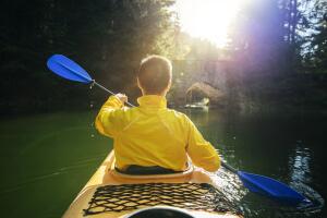 Peaceful kayak tour in a beautiful mountain lake.