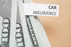 Paper with words car insurance and money.
