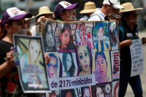 Relatives participate in the 'March of Silence' during a demonstration against femicide and violence against women, in Mexico City