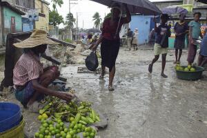 people walk to an open market in the rai