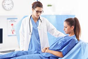 Female doctor taking care of patient in hospital