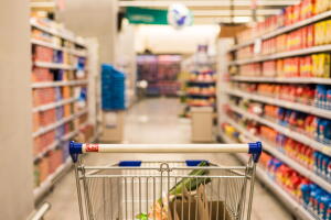Shopping cart in a supermarket. Shopping, cooking, and price concept.