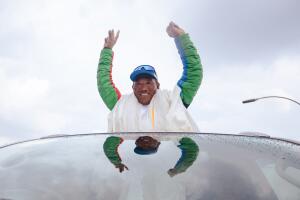 Legendary Mountaineer Kami Rita Sherpa waves at people as he
