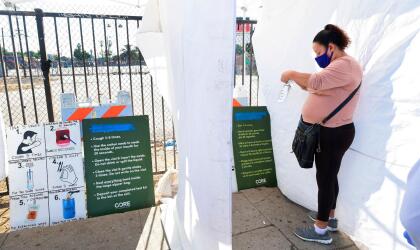 A woman, who just tested herself, places her mouth swab into a bag for testing at a pop-up Covid-19 Test site in Los Angeles, California on October 29, 2020, where the testing is walk-up only with no appointments necessary and results in 48 hours. - While cases of Covid-19 in California are up by about 38 percent from two weeks ago, the fewest fatalities from the coronavirus have been reported in a week since mid-April. (Photo by Frederic J. BROWN / AFP) (Photo by FREDERIC J. BROWN/AFP via Getty Images)