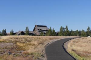 Winding concrete walkway to the Old Faithful Inn, the most sought-after hotel at the Yellowstone National Park.