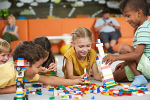 Children building blocks in kindergarten.