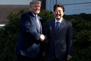 U.S. President Donald Trump shakes hands with Japan’s Prime Minister Shinzo Abe at Kasumigaseki Country Club in Kawagoe