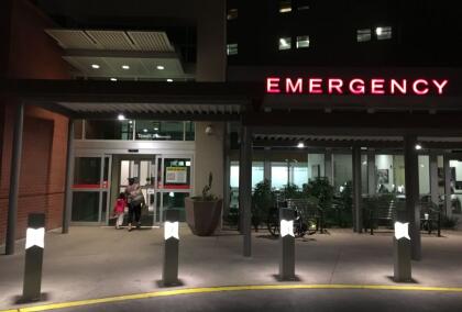 People walk into the emergency room at the hospital treating some of the children injured in an ambush on members of the American Mormon community near the US-Mexico border, in Tucson, Arizona, on November 5, 2019. - Gunmen ambushed the members of the LeBaron family -- a large clan of Mormons who emigrated to Mexico in the late 19th century -- on a rural road on November 4, between the states of Sonora and Chihuahua, which border the United States. US President Donald Trump offered on November 5 to help Mexico "wage war" on its cartels after three women and six children from an American Mormon community were murdered in an area notorious for drug traffickers. (Photo by Sébastien VUAGNAT / AFP) (Photo by SEBASTIEN VUAGNAT/AFP via Getty Images)