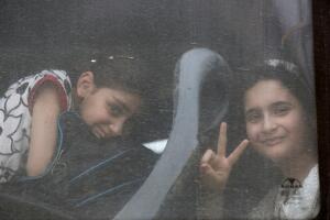 Displaced Iraqis who had fled their homes are seen as they wait for transfer to eastern Mosul, after their arrivial at Hammam al-Alil camp check point south of Mosul