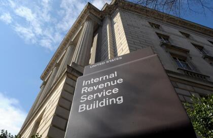 FILE - In this photo March 22, 2013 file photo, the exterior of the Internal Revenue Service (IRS) building in Washington. Politicians love trying to use the tax code to highlight their goals to voters. This year, it’s a battlefield between Hillary Clinton, who wants to boost levies on the rich to pay for expanding social programs and Donald Trump, who says cutting taxes would gird the economy. The clash has consequences for the rich, poor and those in the middle. (AP Photo/Susan Walsh, File)