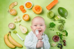Colorful baby food purees in glass jars