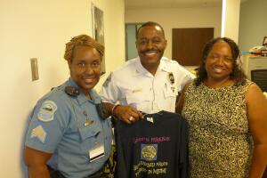 Delrish Moss with female officers